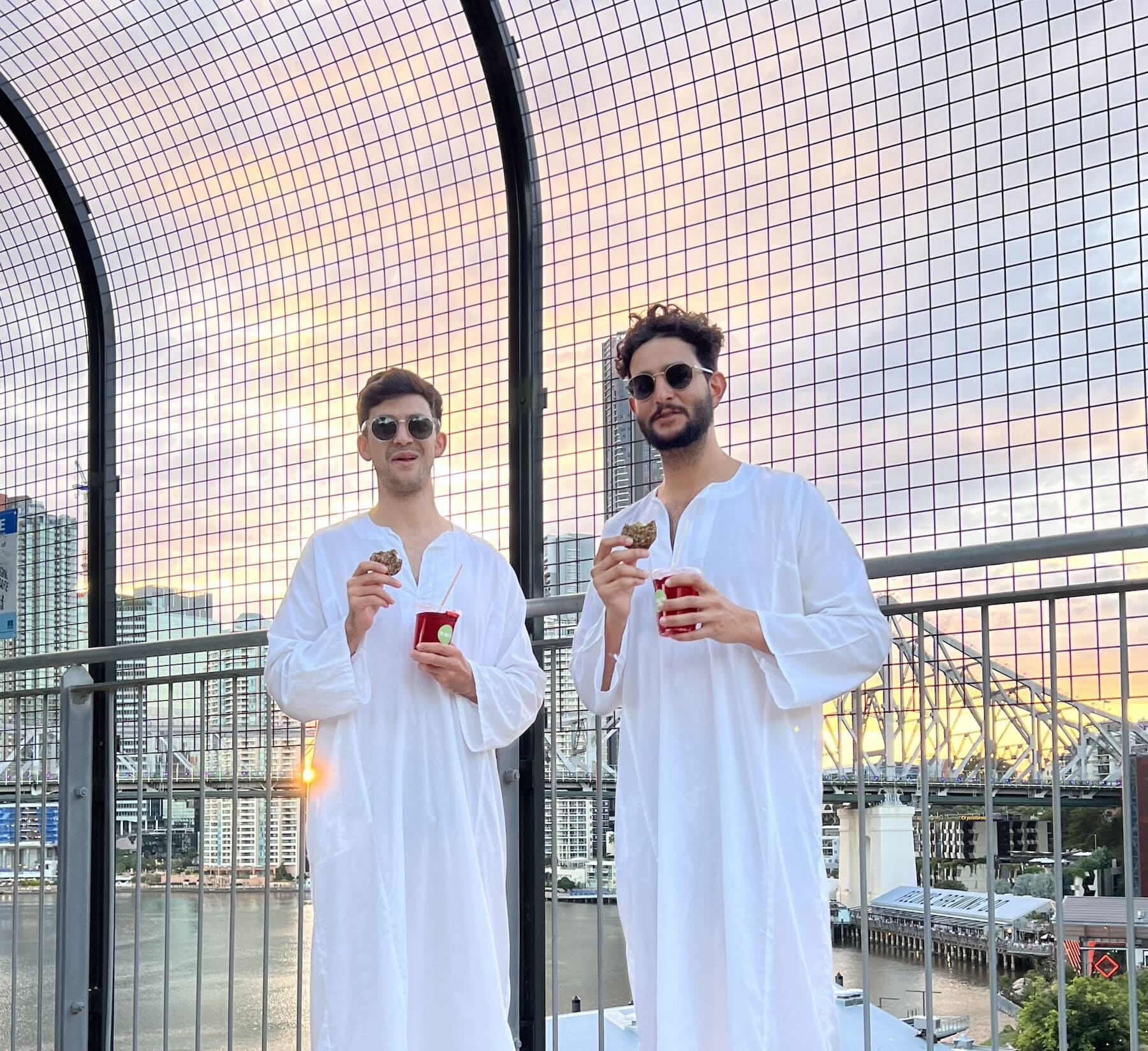 2 Men standing in the sunset